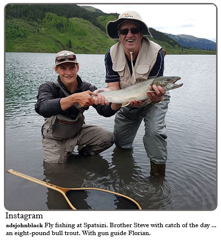 Fly fishing at Spatsizi. Brother Steve with catch of the day...an eight pound bull trout. With gun guide Florian.